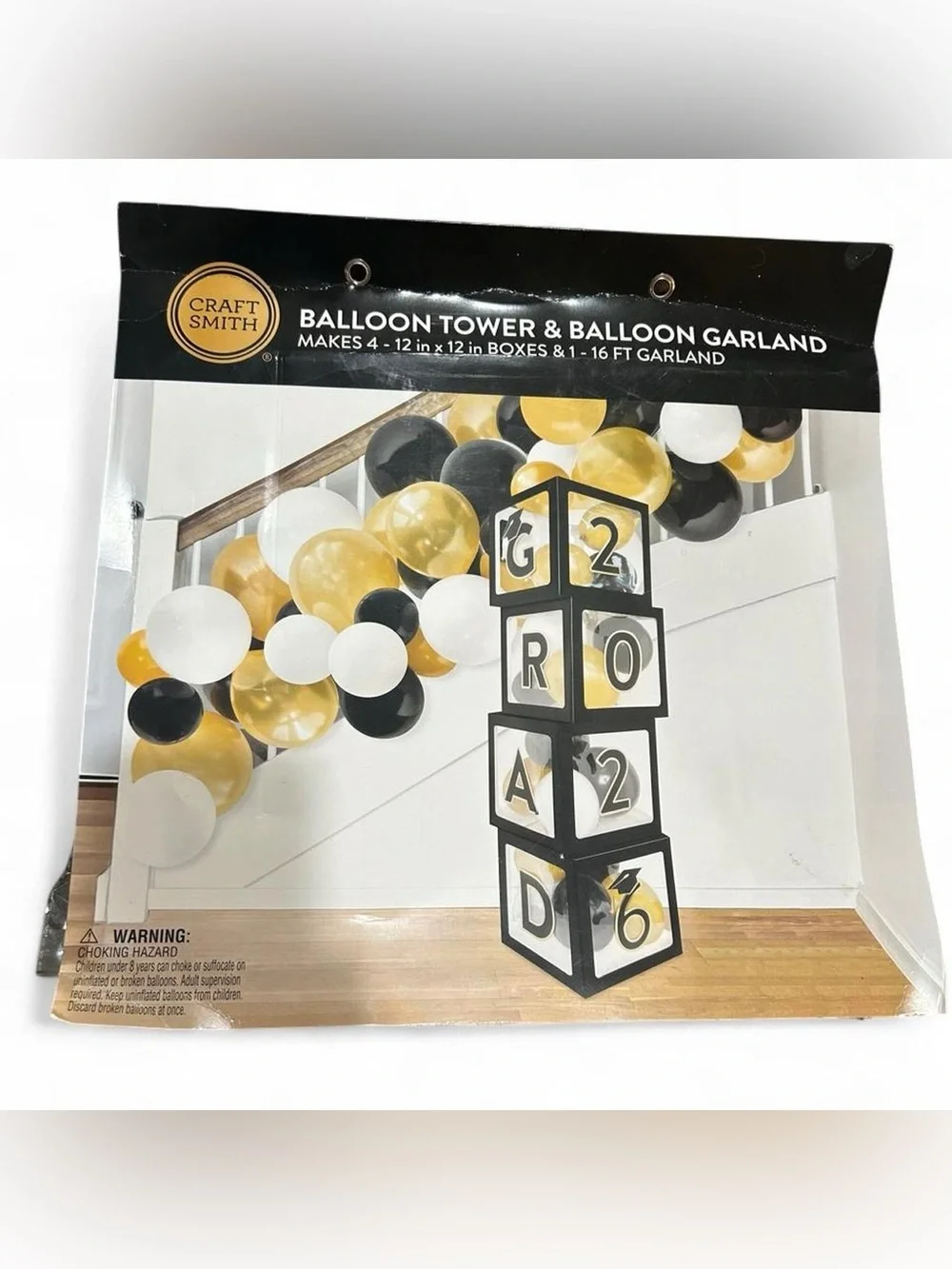 Graduation party decorations - balloon tower and banner with gold and black
